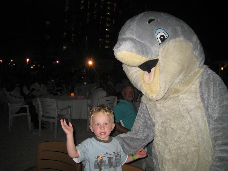 IMG_3237.JPG - Hunter gets to meet the dolphin (he got to touch a real one named Misty at Dolphin Cove)